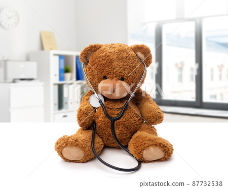 teddy bear with stethoscope on white background teddy bear with stethoscope on white background 87732538