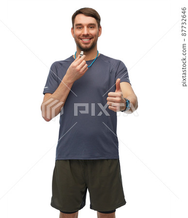 trainer or referee with whistle showing thumbs up 87732646