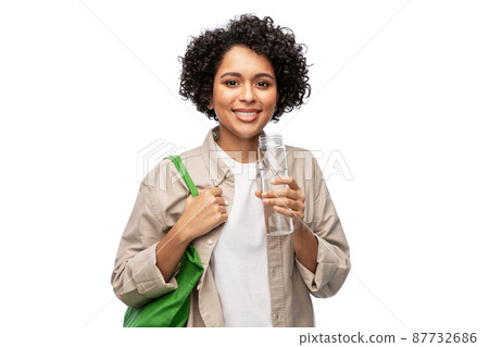 happy woman with water in glass bottle and shopper happy woman with water in glass bottle and shopper 87732686