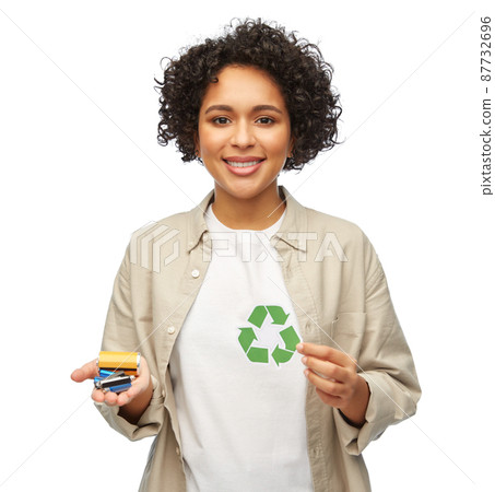 woman holding green recycling sign and batteries woman holding green recycling sign and batteries 87732696