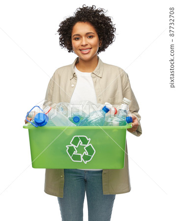 smiling young woman sorting plastic waste 87732708