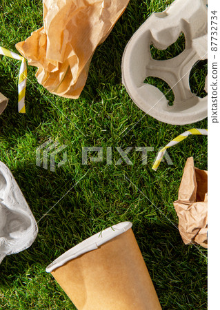 close up of paper waste on grass close up of paper waste on grass 87732734