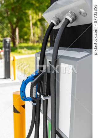 close up of gasoline nozzle at gas station 87732859