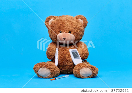 teddy bear with glucometer and insulin syringe 87732951