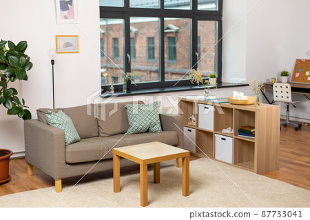 sofa with cushions at cozy home living room 87733041