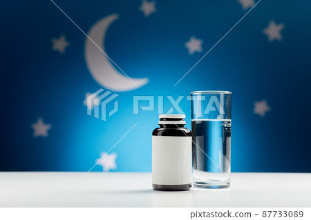 glass of water and soporific medicine at night glass of water and soporific medicine at night 87733089