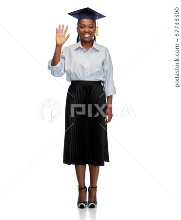 happy female graduate student waving hand happy female graduate student waving hand 87733300