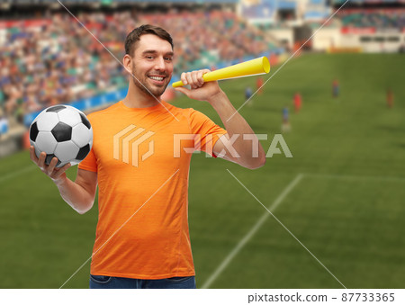 male football fan with soccer ball and vuvuzela 87733365