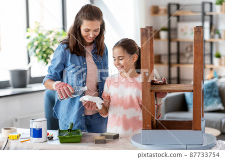 mother and daughter using paint remover for table mother and daughter using paint remover for table 87733754