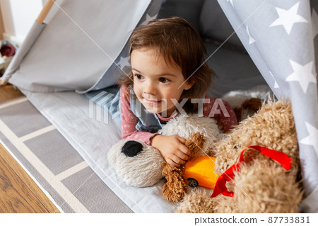 baby girl playing with toys in or teepee at home baby girl playing with toys in or teepee at home 87733831