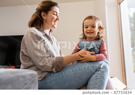 mother and daughter playing at home mother and daughter playing at home 87733834