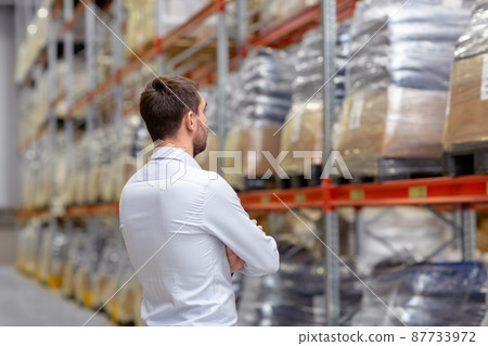 businessman at warehouse businessman at warehouse 87733972