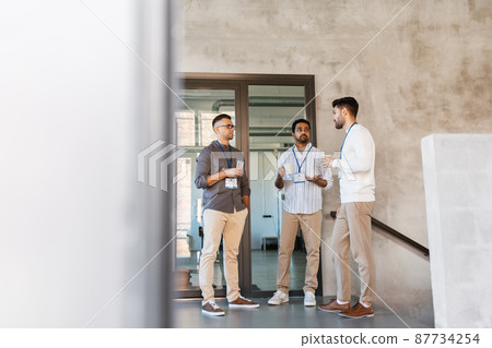 businessmen drinking coffee and water at office businessmen drinking coffee and water at office 87734254