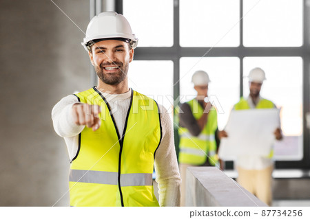 male architect in helmet and safety west at office male architect in helmet and safety west at office 87734256