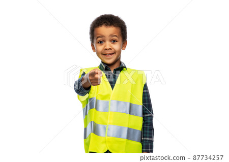 little boy in safety vest over white background little boy in safety vest over white background 87734257
