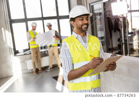 male architect with clipboard and pencil at office male architect with clipboard and pencil at office 87734263