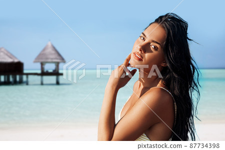 beautiful young woman in bikini swimsuit on beach beautiful young woman in bikini swimsuit on beach 87734398