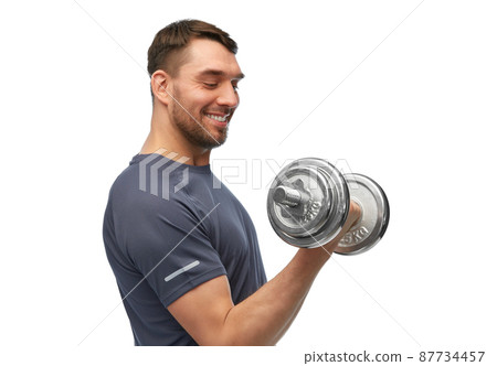 happy smiling man exercising with dumbbells happy smiling man exercising with dumbbells 87734457