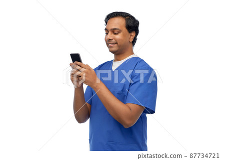 smiling doctor or male nurse using smartphone smiling doctor or male nurse using smartphone 87734721