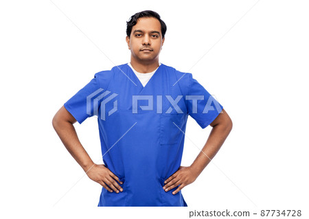 indian doctor or male nurse in blue uniform 87734728