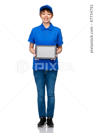 delivery woman in blue uniform with tablet pc delivery woman in blue uniform with tablet pc 87734791