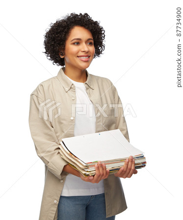 smiling woman with magazines sorting paper waste smiling woman with magazines sorting paper waste 87734900