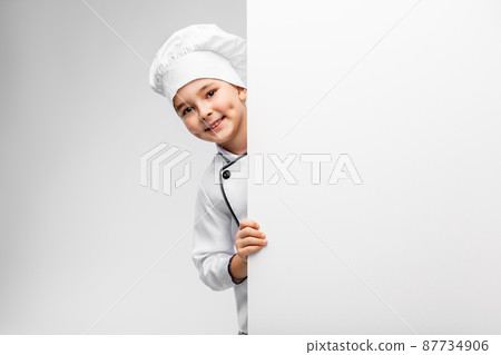 happy little boy in chef's toque with white board happy little boy in chef's toque with white board 87734906