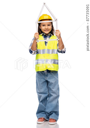 little girl in helmet with ruler in shape of house little girl in helmet with ruler in shape of house 87735091