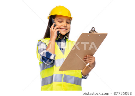girl in helmet with clipboard calling on phone girl in helmet with clipboard calling on phone 87735098
