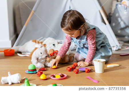 baby girl playing tea party with toys at home baby girl playing tea party with toys at home 87735356
