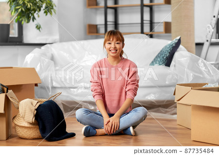 happy woman with boxes moving to new home happy woman with boxes moving to new home 87735484