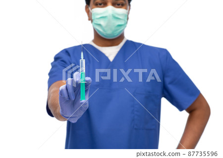 male doctor in mask and gloves with syringe 87735596