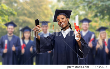 happy female graduate student with diploma 87735604