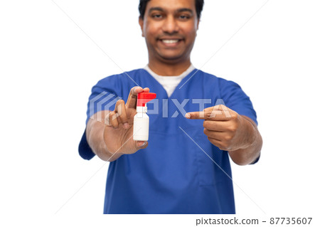 smiling doctor or male nurse with medicine smiling doctor or male nurse with medicine 87735607