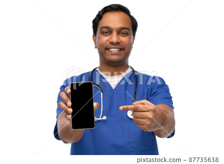 smiling doctor or male nurse showing smartphone 87735638