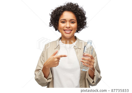 happy woman with water in plastic bottle happy woman with water in plastic bottle 87735833