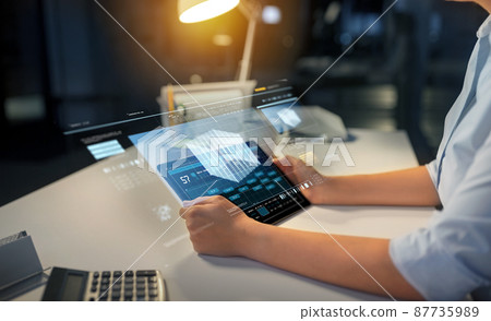 businesswoman with tablet computer at night office businesswoman with tablet computer at night office 87735989