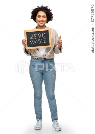 woman with zero waste words on chalkboard 87736076