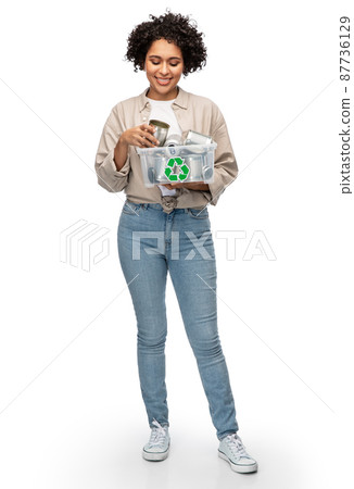 happy smiling woman sorting metallic waste 87736129