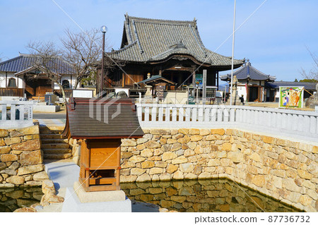 [Chugoku 33 Kannon Sacred Ground] No. 2 Main Hall and Benten-do Hall of Yokeiji Temple on a sunny winter day 2 Setouchi City, Okayama Prefecture 87736732