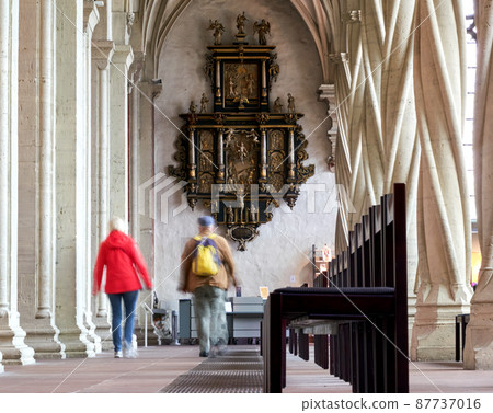 Frescoes at the end of a portico behind the rows of chairs in a Christian cathedral Frescoes at the end of a portico behind the rows of chairs in a Christian cathedral 87737016