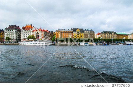 Panoramic view from the tourist boat on the pier with boats and the beautiful buildings of Stromkayen in the center of Stockholm Sweden Panoramic view from the tourist boat on the pier with boats and the beautiful buildings of Stromkayen in the center of Stockholm Sweden 87737600