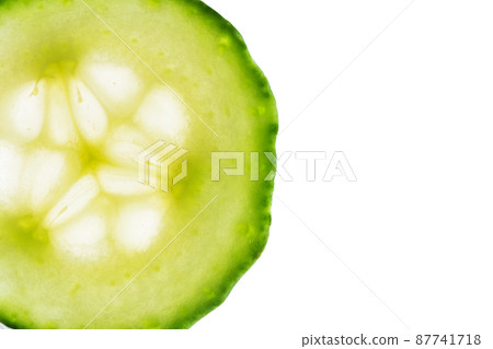 Slice of cucumber isolated on white background. Fresh slice of cucumber for design with copy space. 87741718