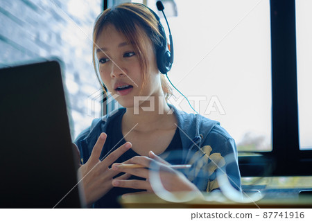 E-learning ,online ,education and internet social distancing protect from COVID-19 viruses concept. Asian woman student video conference e-learning with teacher on digital tablet at home. E-learning ,online ,education and internet social distancing protect from COVID-19 viruses concept. Asian woman student video conference e-learning with teacher on digital tablet at home. 87741916