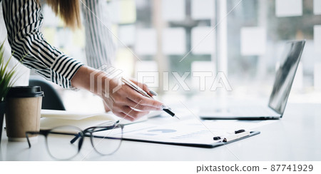 Business woman investment consultant analyzing and audit of company budget. finance and accounting concept. Business woman investment consultant analyzing and audit of company budget. finance and accounting concept. 87741929