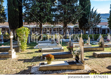 Detail on the christian graveyard with marble tombs and crosses in Jaca, Spain 87742831