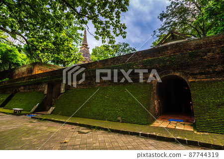 Ancient tunnel at (Wat Umong Suan Puthanatham) is a Buddhist temple is a major tourist attraction with green forest nature in Chiang Mai,Thailand. 87744319