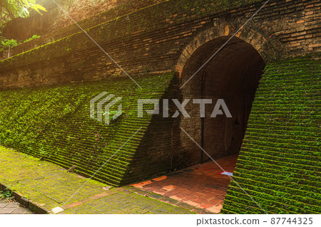 Ancient tunnel at (Wat Umong Suan Puthanatham) is a Buddhist temple is a major tourist attraction with green forest nature in Chiang Mai,Thailand. 87744325