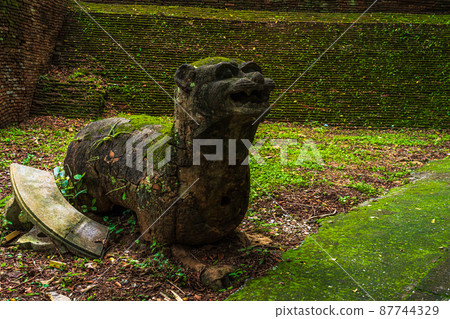Lion sculpture in Thai Lanna traditional style at Wat Umong Suan Puthatham is a major tourist attraction with green forest nature in Chiang Mai,Thailand. 87744329