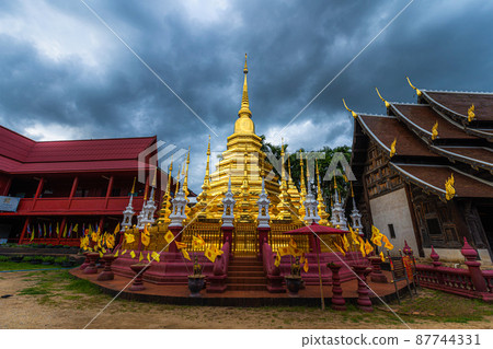 Beautiful Ancient golden color Pagoda in the Phan Tao temple is a Buddhist temple in the historic centre tourist attraction an ancient Thai art and is Public places in Chiang Mai,Thailand. Beautiful Ancient golden color Pagoda in the Phan Tao temple is a Buddhist temple in the historic centre tourist attraction an ancient Thai art and is Public places in Chiang Mai,Thailand. 87744331